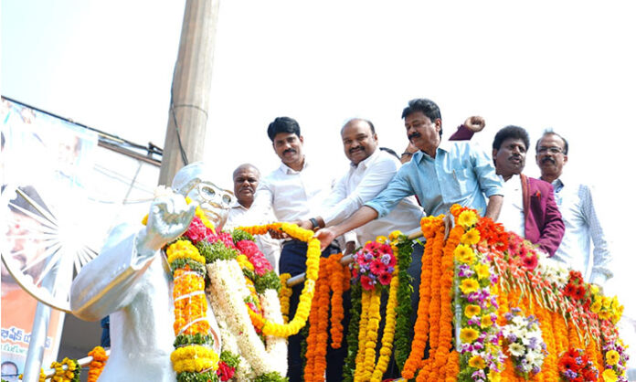 Collector CNarayana Reddy paying tribute to Dr BR Ambedkar during 135th birth anniversary celebrations at Tank Bund