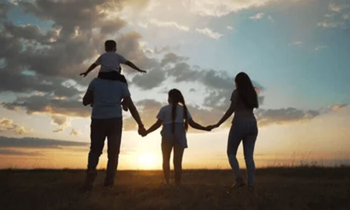 A contemplative scene showing a family enjoying simple joyful moments together, symbolizing that true happiness comes from people, not money.