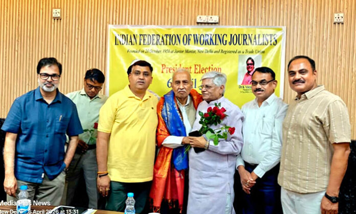 Gopal Mishra elected as IFWJ National President, surrounded by senior journalists and leaders from various Indian states during the announcement at Delhi Journalists Union