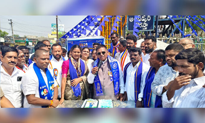 MLA Gaddam Vinod and local leaders paying floral tributes to Dr BR Ambedkar during Jayanti celebrations in Bellampalli