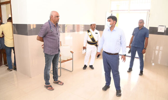 District Collector Kumar Deepak inspecting primary health center in Kannepalli and reviewing facilities and medical services.