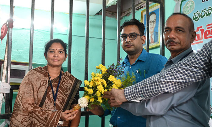 Ankam Mounika and Mohammed Soyab Hussain taking oath as Chairman and Vice-Chairman of Khanapur Municipality after the election, with officials and councilors present.