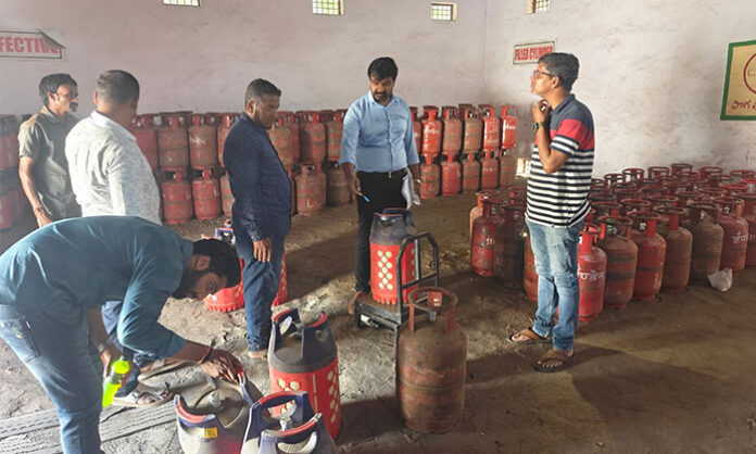 Officials inspecting LPG godowns and dealerships in Hyderabad, Medchal, and Ranga Reddy districts to prevent overcharging of gas cylinders and ensure accurate weights.