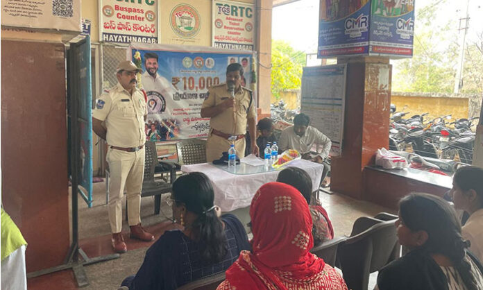 RTC officials felicitate female passengers at Hayathnagar Bus Stand to mark 290 crore travelers under the Mahalaxmi Free Travel Scheme.