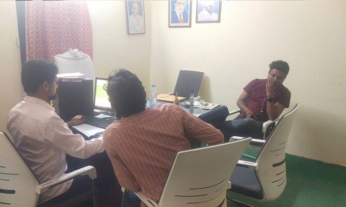 Mothkur Single-Window office employees caught drinking inside the Chairman's chamber during a liquor party, confronting reporters covering the incident.