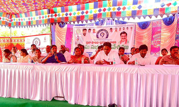 Officials and villagers participating in Praja Palana Gram Sabha discussion at Abdullahpur village focusing on development and welfare schemes.