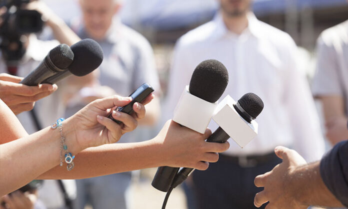A reporter on the field capturing news, symbolizing dedication, truth, and societal responsibility