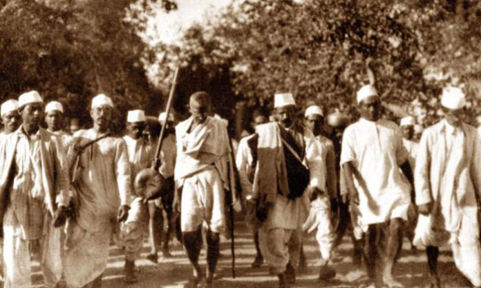 Mahatma Gandhi leading the historic Salt Satyagraha march to Dandi, breaking the British salt law on April 6, inspiring millions across India.