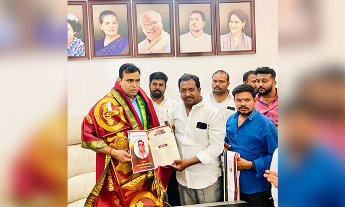 MP Chamala Kiran Kumar Reddy receiving invitation for Sri Lakshmi Narasimha Swamy Kalyana Mahotsavam from local leaders in traditional ceremony.