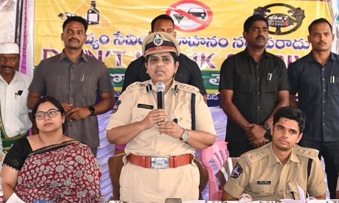 District Collector Abhilasha Abhinav addressing villagers on traffic rules awareness during road safety program in Sarangapur Mandal