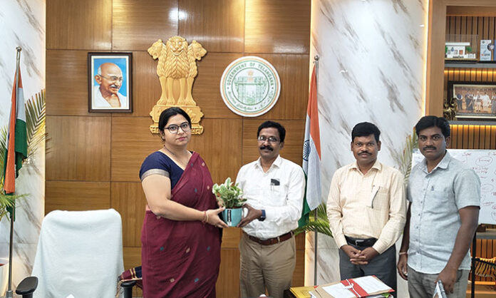 New District Cooperative Officer Srinivasa Rao presenting a potted plant to District Collector Abhilasha Abhinav during courtesy visit at collectorate