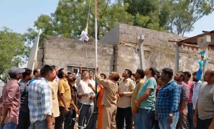 Auto JAC flag hoisting during May Day celebrations in Bellampalli Telangana