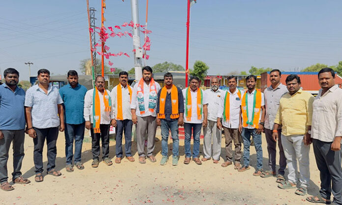 BJP cadres celebrating election victory in Manoharabad Mandal with sweets and firecrackers