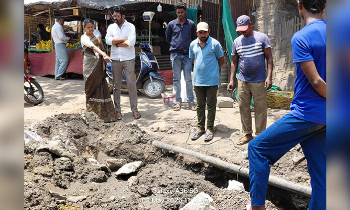 Bellampalli municipal chairperson inspecting pipeline repair works near Singareni Store ensuring quick completion and public safety