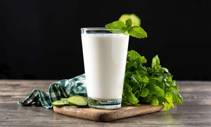 Glass of traditional buttermilk mixed with cumin powder known for aiding digestion and helping manage diabetes naturally.