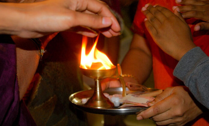 Camphor aarti in Hindu rituals symbolizing spiritual purity removal of ego and positive energy through light worship