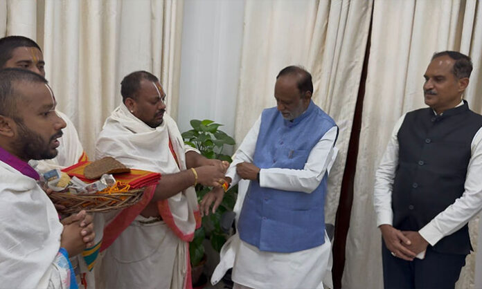 Dr K Laxman assumes charge as Chairman of the Rajya Sabha House Committee at the Parliament complex with officials and MPs present.