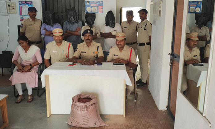 Police and agriculture officials seizing fake cotton seeds during a raid in Tandur under Bellampalli division.