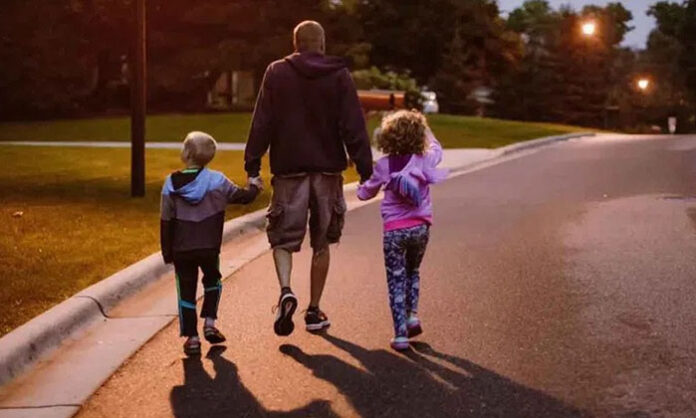 A person taking a short walk after dinner to improve digestion, reduce bloating, and support overall digestive health.