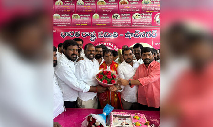 Former MLA Anjaiah Yadav celebrating his birthday at Shadnagar camp office with supporters and political leaders.