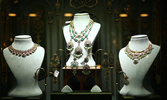 Crowded jewellery exhibition hall showcasing gold, diamond, pearl, and gemstone collections at HITEX Hyderabad