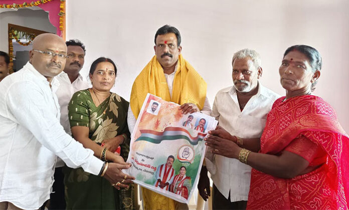 MLA G. Madhusudan Reddy participating in Indiramma Houses housewarming ceremony at Kottakota municipal headquarters with beneficiaries and local officials.