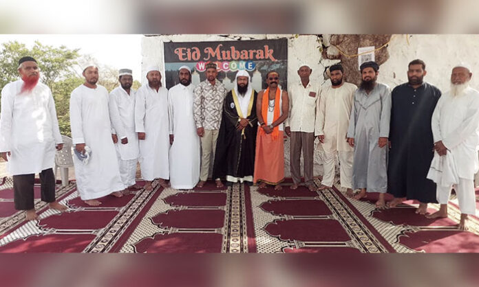BJP leader Jagan Goud greeting members of the Muslim community during Bakrid festival celebrations at Ellampet Eidgah in Medchal district.