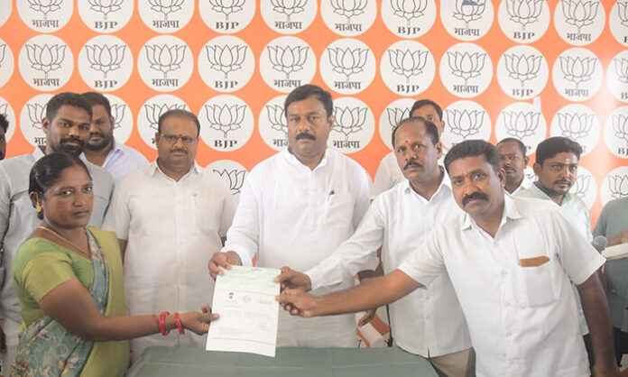 MLA Alleti Maheshwar Reddy and MP Godam Nagesh distribute Chief Minister Relief Fund cheques to beneficiaries at Nirmal MLA camp office.