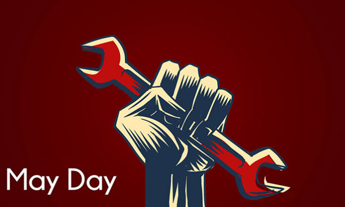Workers raising their voices in unity on May Day demanding rights and fair treatment