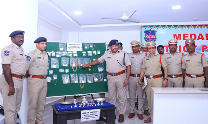 Medak police recovering stolen gold and silver ornaments after solving a major robbery case in Chilapalli village within ten days.