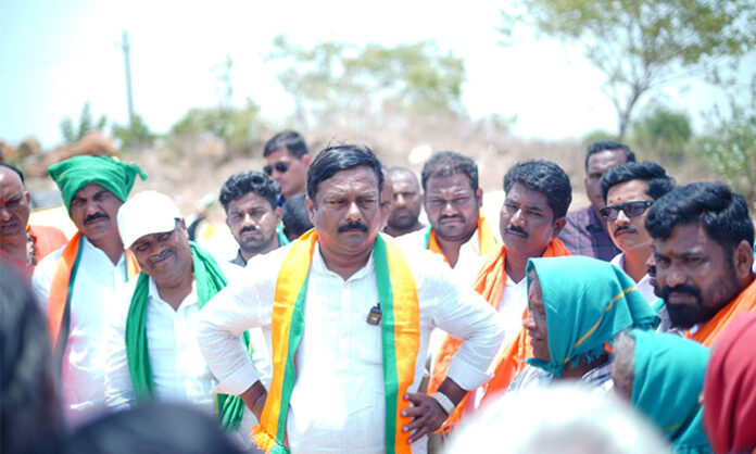 Nirmal MLA Aleti Maheshwar Reddy inspecting grain heaps at the procurement center in Mamada Mandal during the Rythu Gosa BJP Bharosa Yatra.