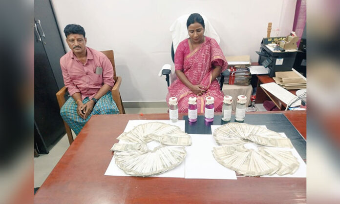 ACB officials arresting Shamirpet Tahsildar Sucharita in connection with a ₹30 lakh bribe case for land conversion