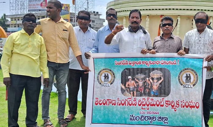 Singareni retired employees wearing black ribbons protest in Mancherial against petrol, diesel and cooking gas price hikes.