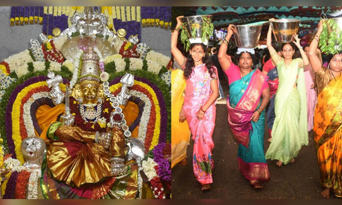 Devotees celebrating Tirupati Gangamma Jatara with traditional costumes and rituals