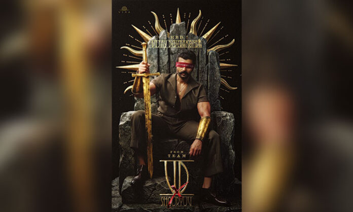 Vijay Deverakonda seated on a throne holding a sword in the birthday poster of his upcoming pan-India film.