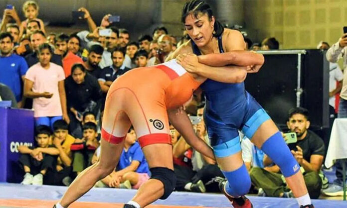 Indian wrestler Vinesh Phogat competing in the Asian Games selection trials and securing a dominant victory over her opponent.