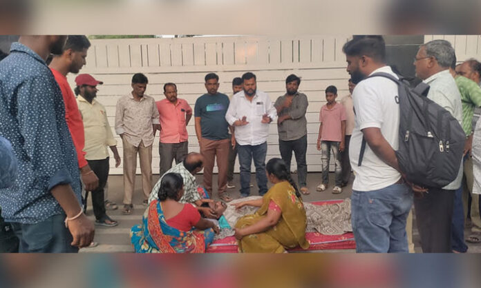Workers and family members protest following the alleged suicide of a Natco Pharma employee in Nandigama Mandal.