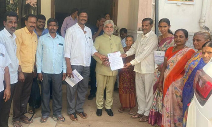 Villagers of Anthammagudem submitting a memorandum to Telangana Assembly Speaker against severe chemical industry pollution affecting water and environment.
