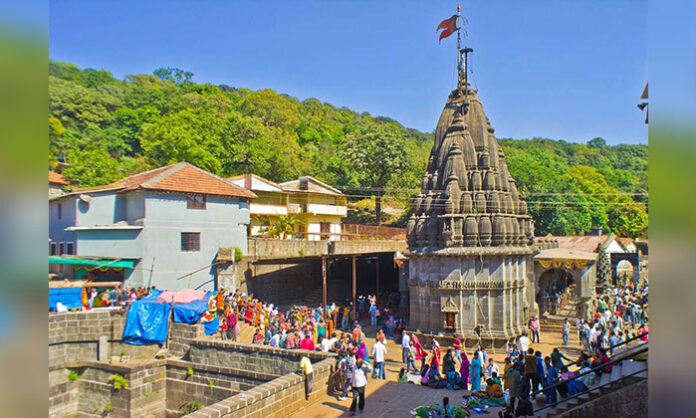 Bhimashankar Jyotirlinga temple surrounded by Sahyadri mountains, announcing reopening for devotees with online booking system starting June 5.