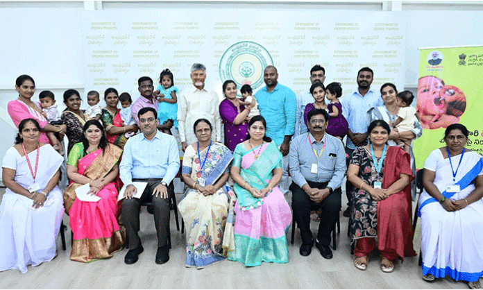 Chief Minister Chandrababu Naidu administers polio drops to children during the launch of the Pulse Polio programme at his camp office in Amaravati on National Immunization Day.