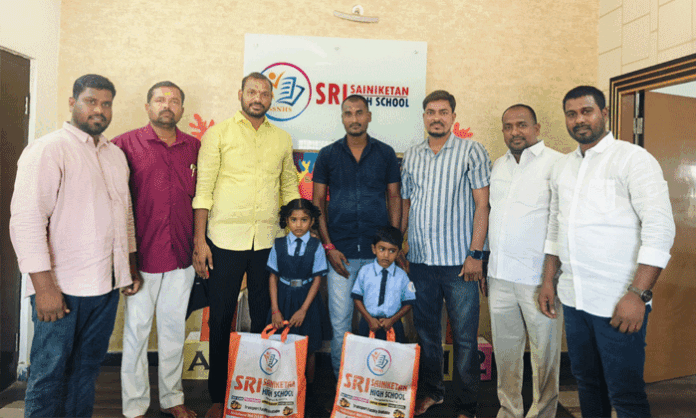 Deputy Sarpanch Anthati Sushma Ashok Goud provides textbooks and educational fee support to two children from a financially struggling family in Abdullapurmet village.