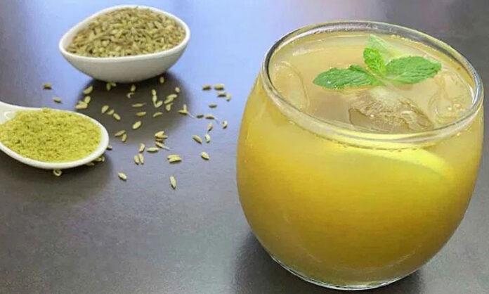 Glass of fennel sherbet with basil seeds served as a traditional cooling summer drink for hydration and digestion.