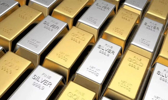 Gold and silver jewelry displayed in a market showing slight price decline in Indian bullion rates across cities.