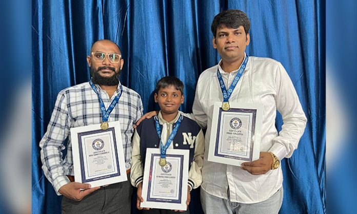 Young students from Shantinagar Colony, Peddamberpet in Hyderabad celebrating their Guinness World Record achievement in a large-scale keyboard music performance event.