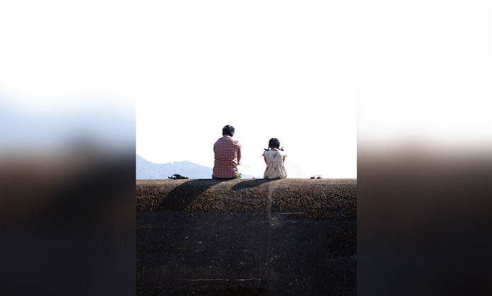 Ravi Teja and Shiva Nirvana’s Irumudi movie glimpse poster featuring a father and daughter seated on a hill, set for release on June 3.