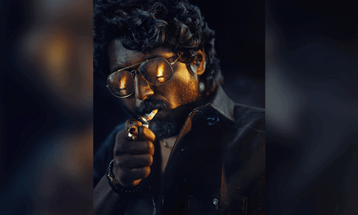 Actor Suhas undergoes a dramatic physical transformation for his negative-shaded role in MANDAADI, as revealed in the film's behind-the-scenes video.
