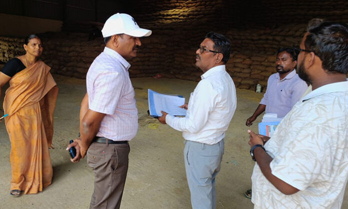 District officials reviewing paddy procurement and directing allocation of additional lorries for grain transportation in Mancherial district.