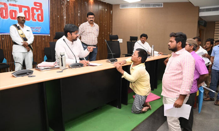 District Collector Kumar Deepak receiving Prajavani grievance petitions from citizens at Integrated District Offices Complex in Mancherial district