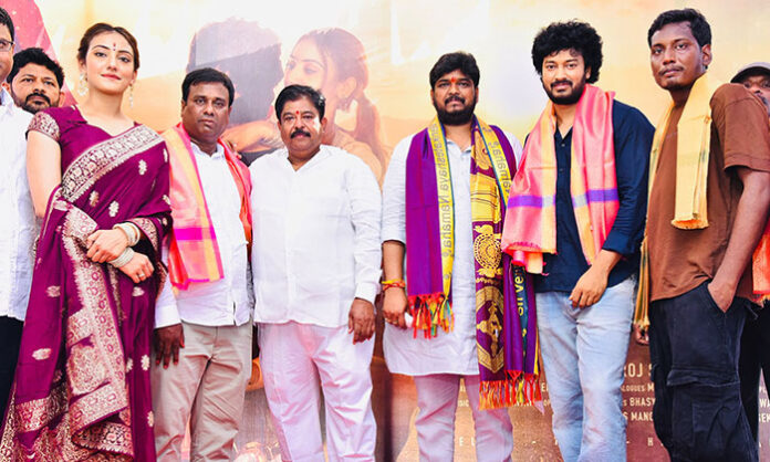 MLA Naveen Yadav launching the Muhabbat movie with clap and first look release during grand pooja ceremony with film team on stage.