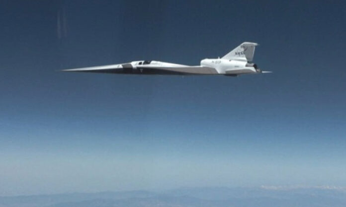NASA X-59 experimental aircraft during supersonic test flight demonstrating silent sonic boom technology.